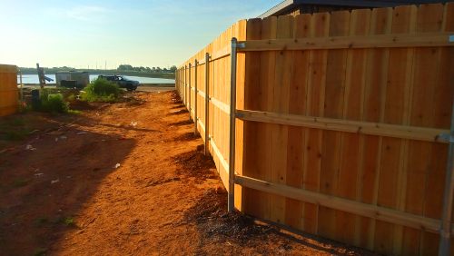 a wood fence built around a property